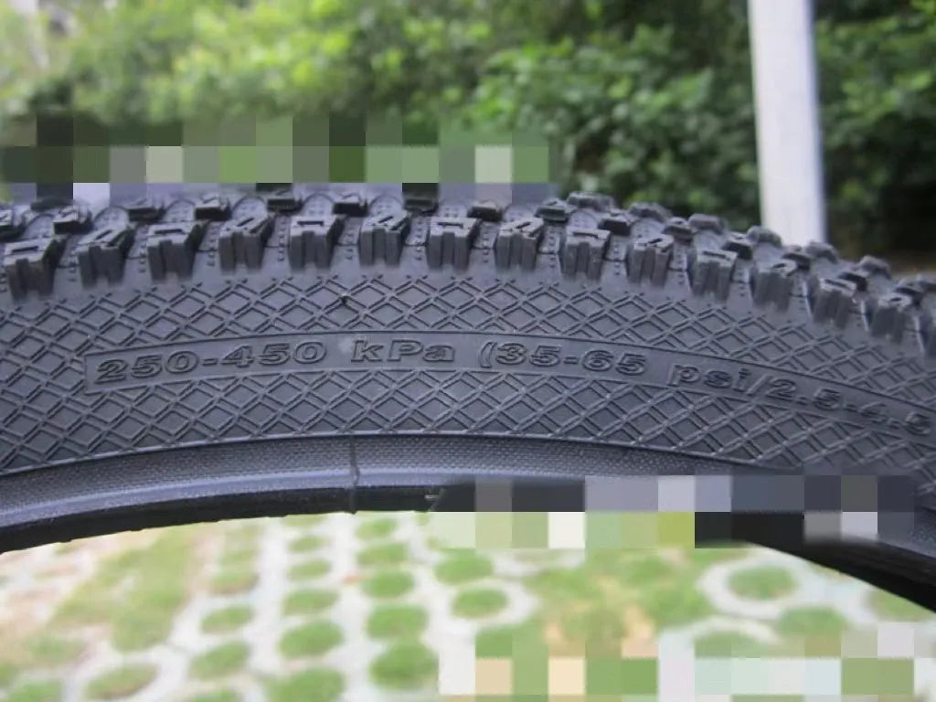 Ultralight mountain bike tyre with knobbly tread, shown in multiple size options including 26, 27.5 and 29 inch.