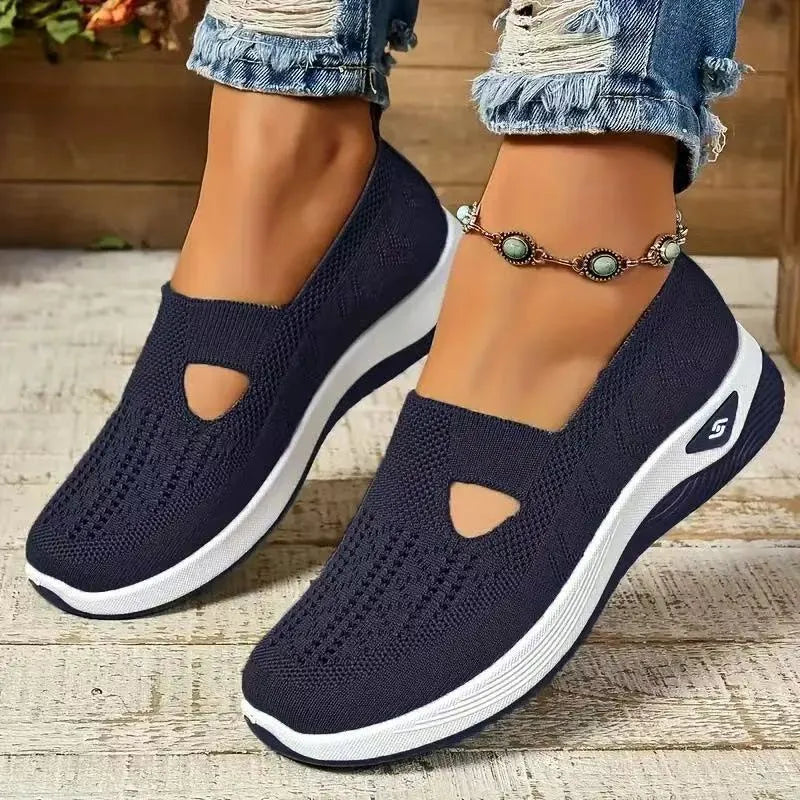 Women's solid colour mesh T-strap casual shoes with flat heel and round toe.