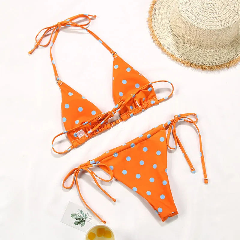 Women's polka dot print split bikini swimsuit in briefs and triangle styles on a mannequin