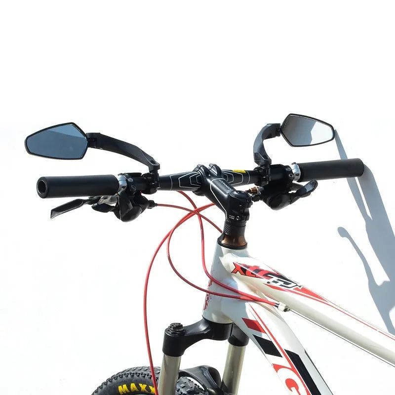 Black acrylic bicycle rearview mirror with rotatable adjustment mechanism mounted on handlebars