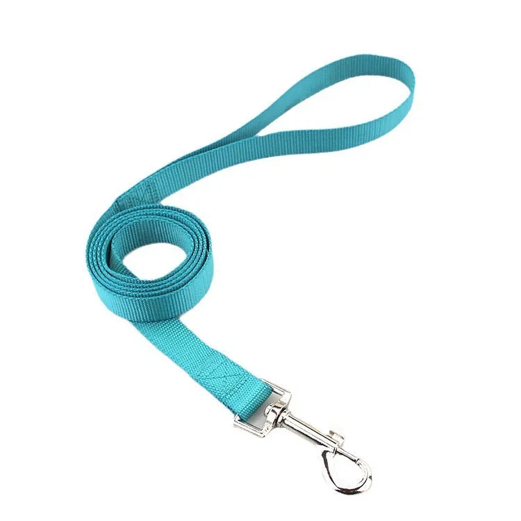 Solid colour polyester dog walking rope held in a hand, showing one of twelve colour options and its simple rope design.