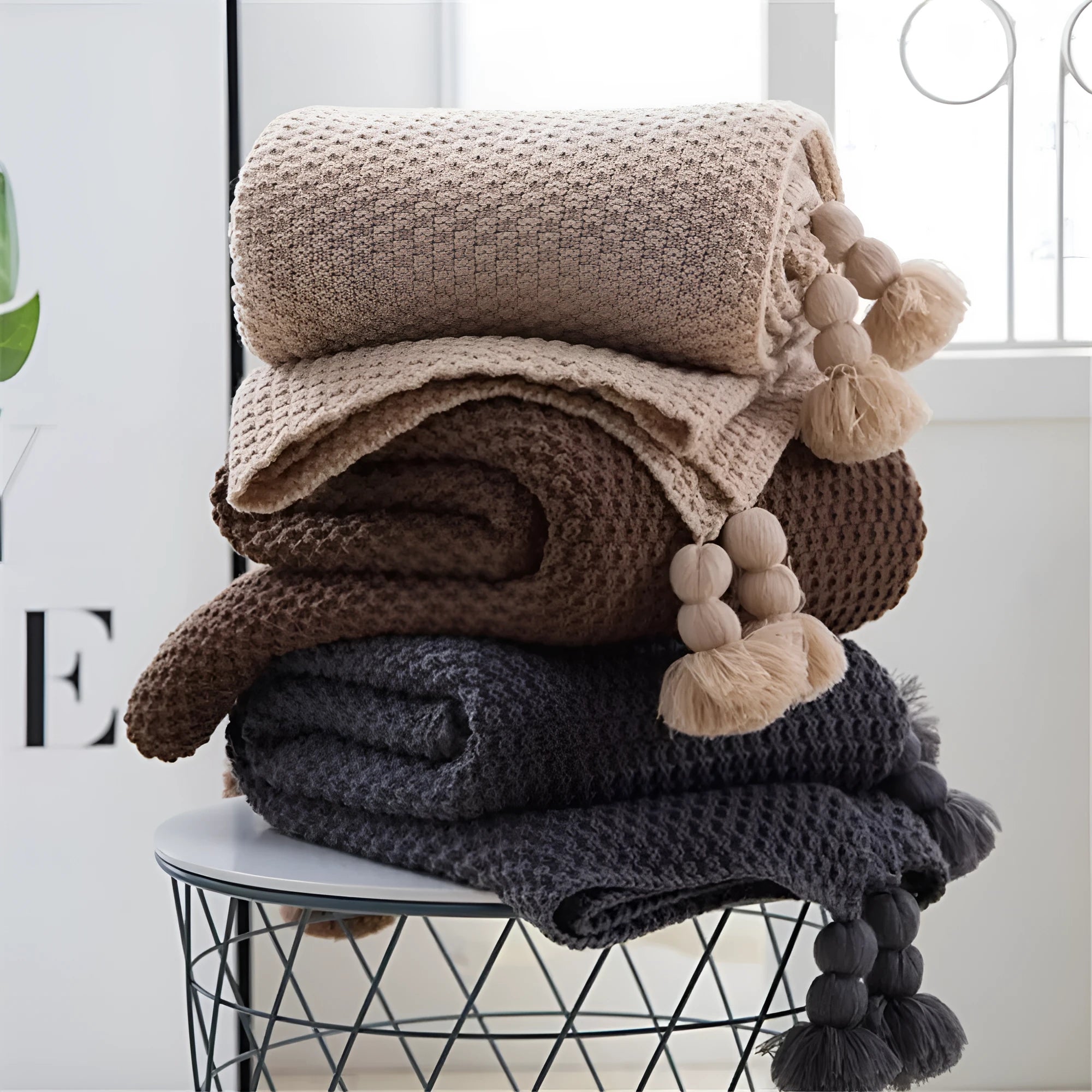 Nordic style fringed acrylic knit blanket in plain weave showing beige colour option