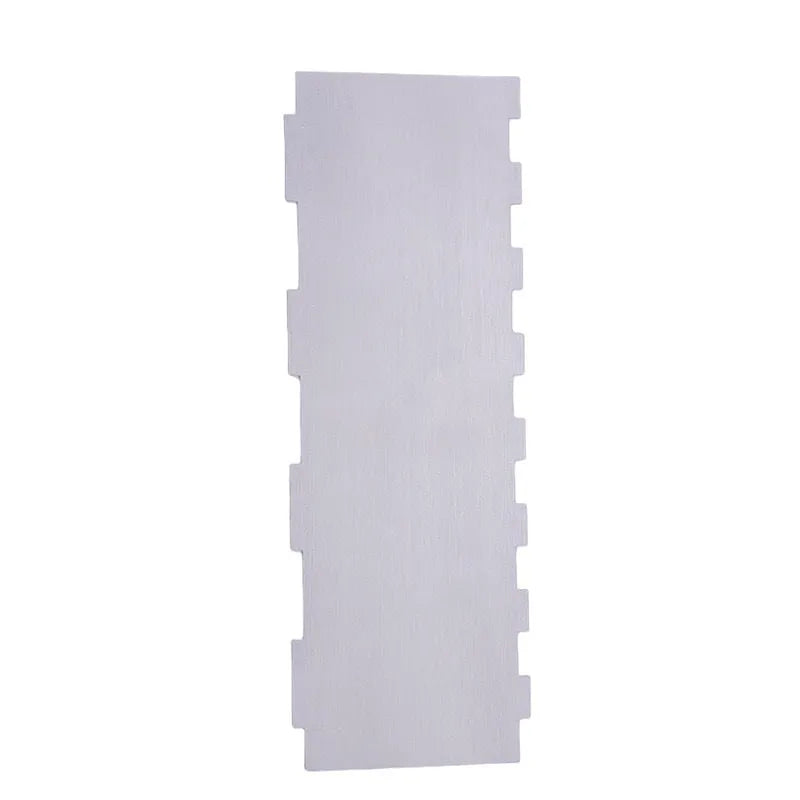 Stainless steel cake scraper with a polygon-patterned edge for textured icing.