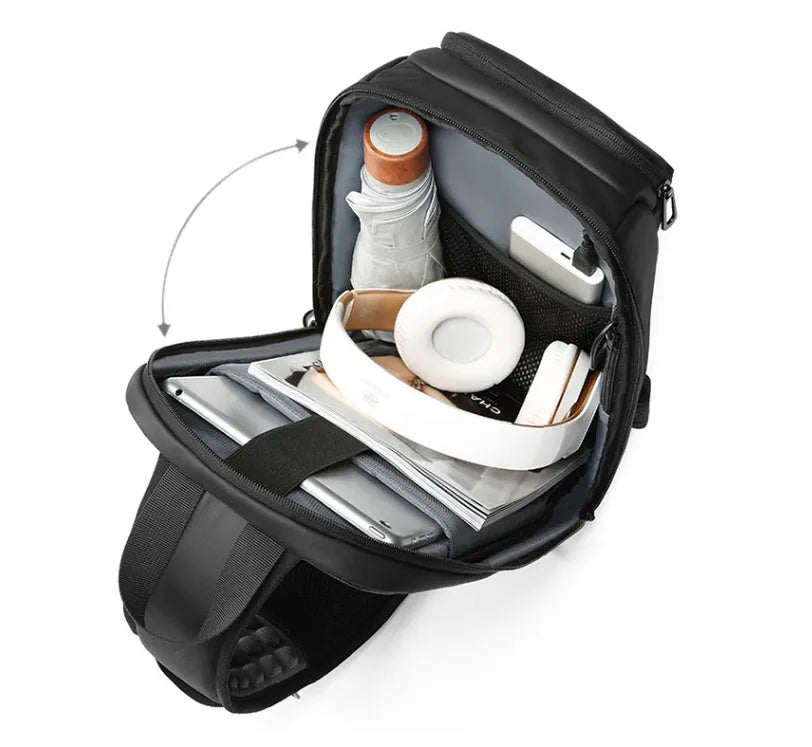 Black PVC outdoor shoulder bag with air cushion strap, soft handle, and laptop compartment
