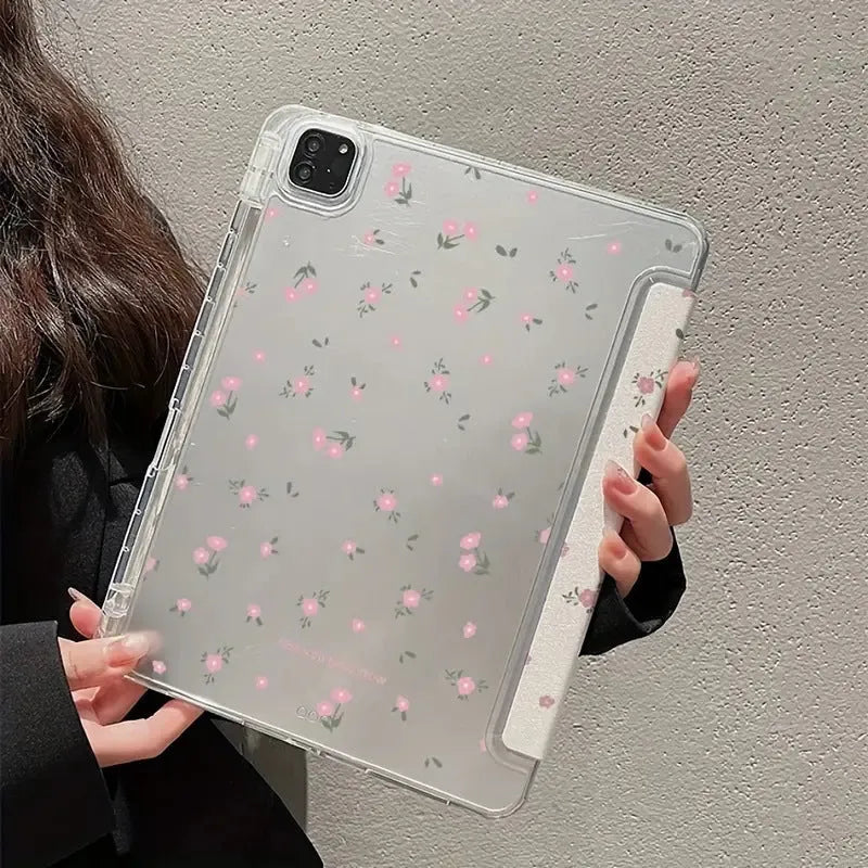 Transparent floral tri-fold iPad case with magnetic stand, showing cartoon print on clear PC hard shell.