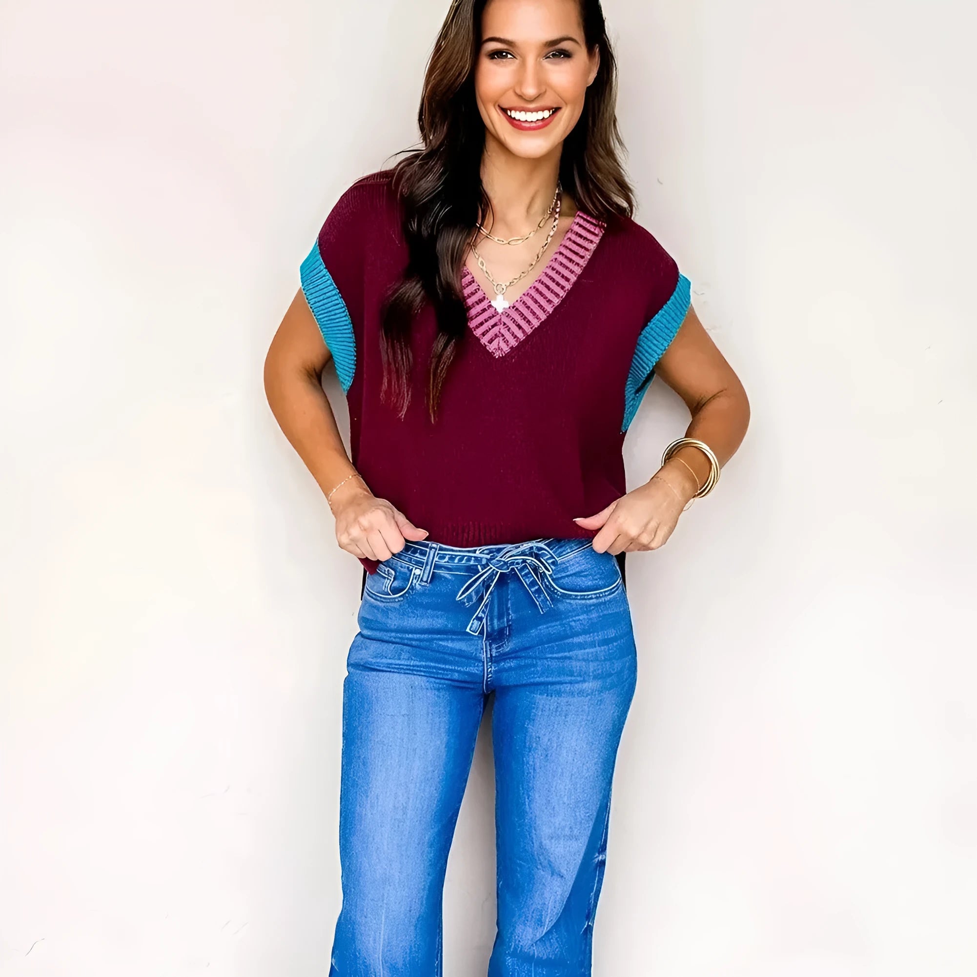 Burgundy loose V-neck sweater with contrast trim on short cuffed sleeves