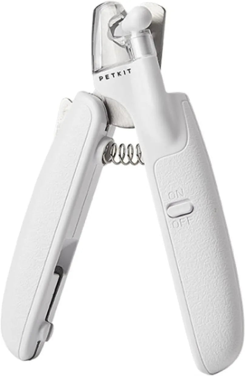 White pet nail clippers with LED light and transparent splash guard open, showing the triangular steel blade.