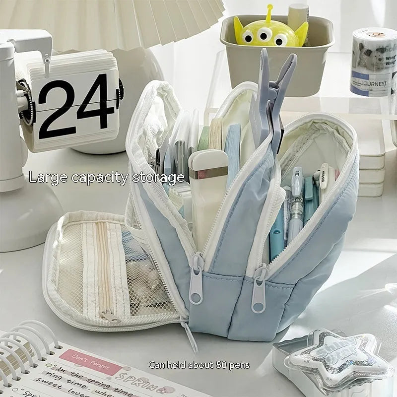 Double layer zippered pencil case in blue, cream, green, or pink with a gift handle