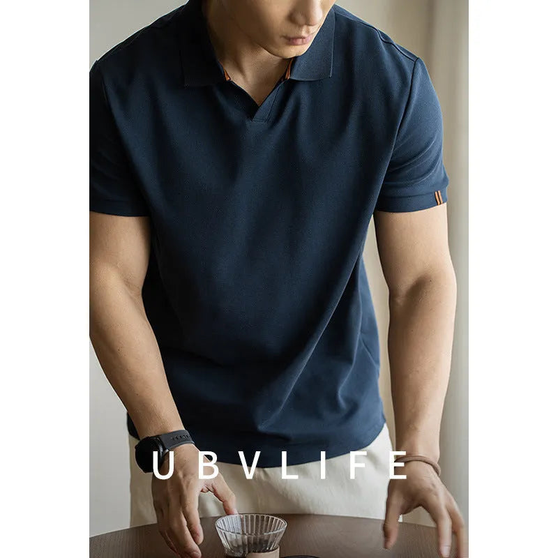 Men's short-sleeve cotton polyester polo shirt in blue, black and white colours showing regular fit design
