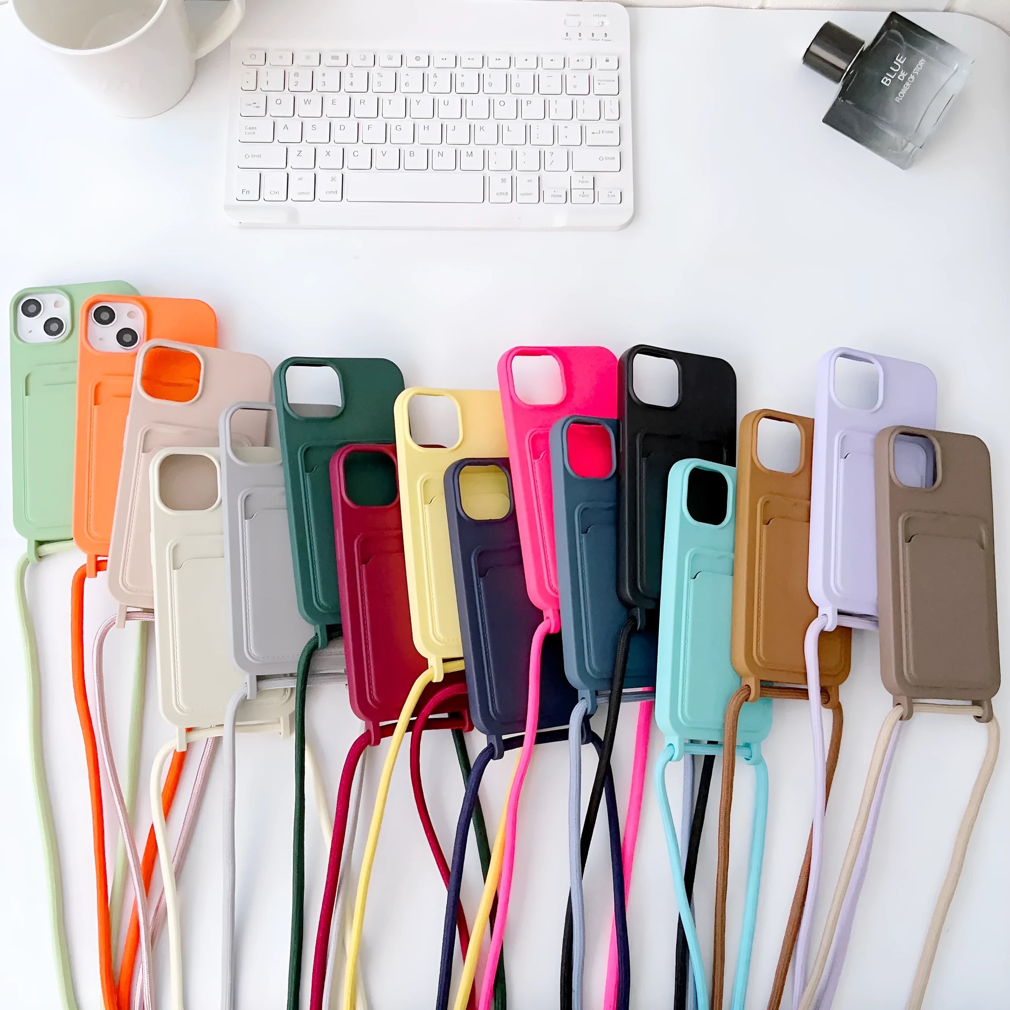 Cross body lanyard TPU phone case with card holder for Apple iPhone models, available in antique white, gray, and light pink
