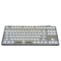 Universal transparent plastic 132-key mechanical keyboard key cap set laid out.