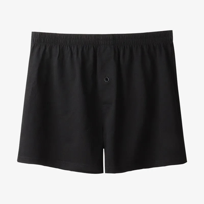 Men's solid colour cotton boxer shorts with a high waistband and loose leg.