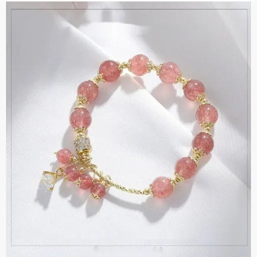 Pink strawberry quartz crystal bracelet with heart shape and pearl accents