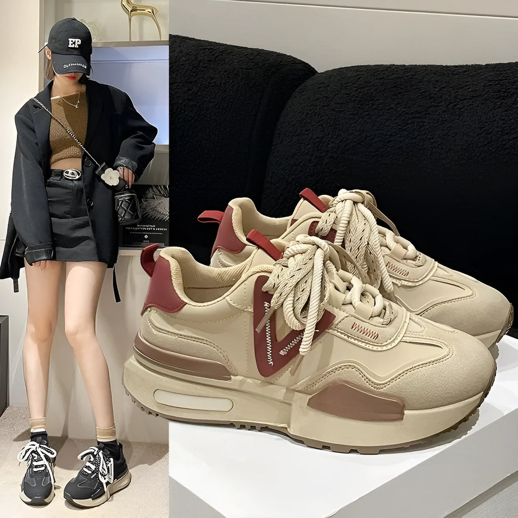 Women's black retro platform sports shoes with round toe and lace-up fastening on a neutral background.