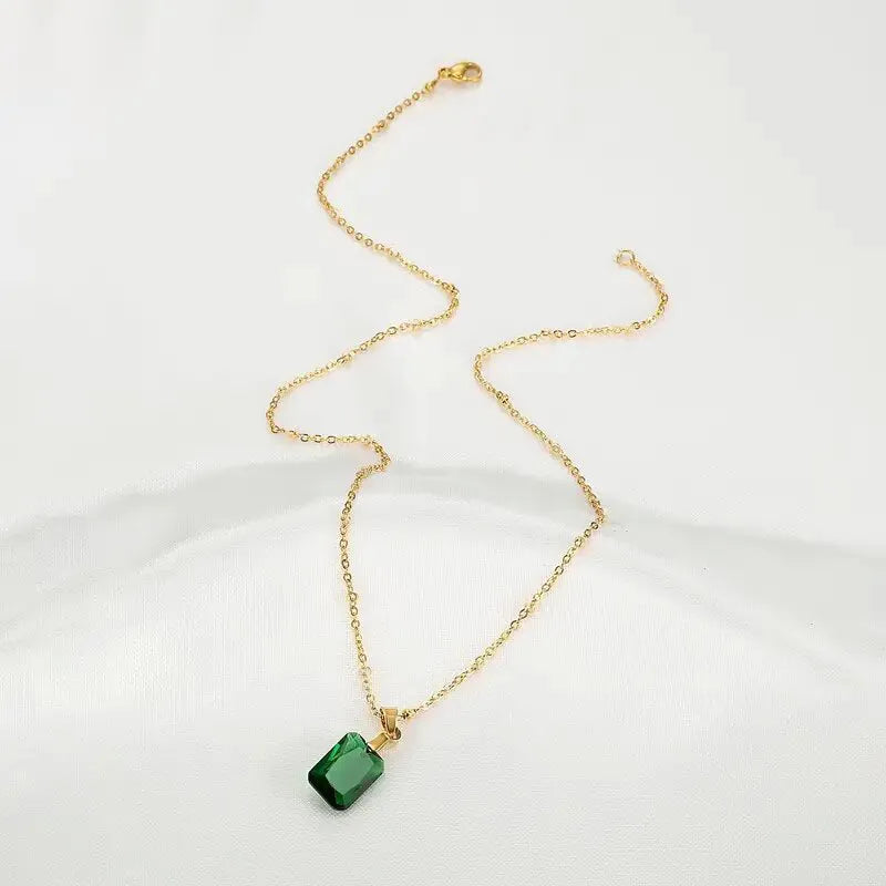 Copper necklace with green rectangular geometric quadrilateral pendant on O-ring chain.