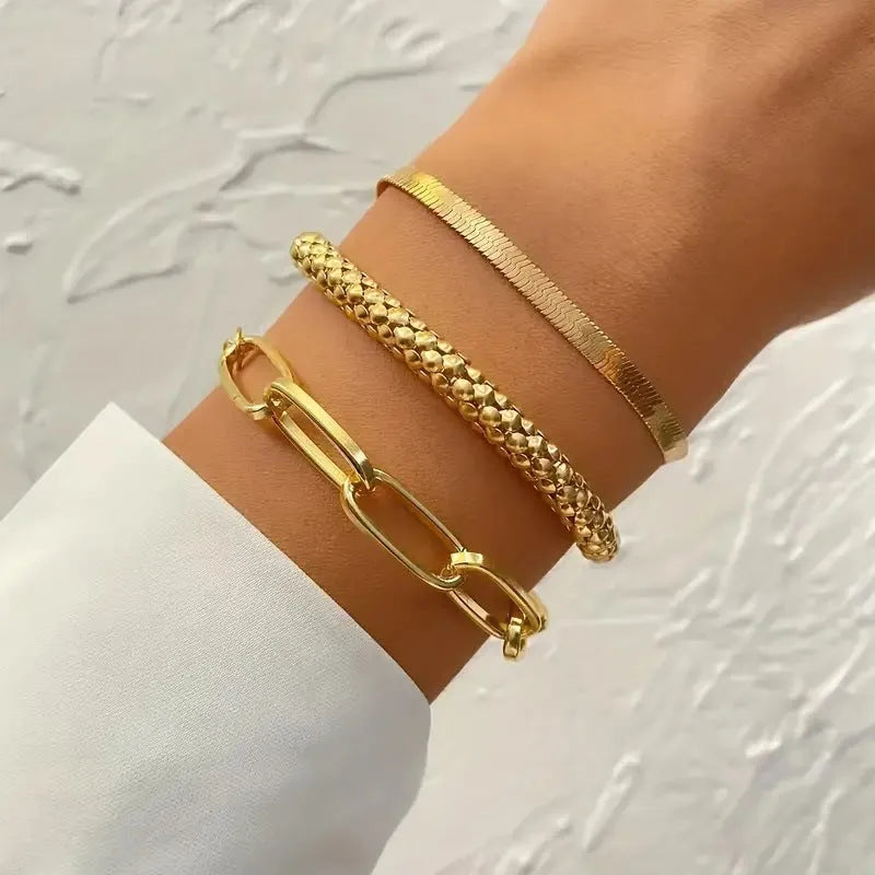 Set of three alloy snake bone chain bracelets in retro geometric design with electroplated gold finish