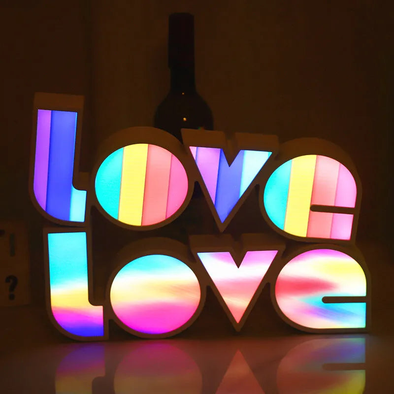 Colourful rainbow LED decorative light spelling LOVE, with USB cable, for Valentine's Day or wedding decor.