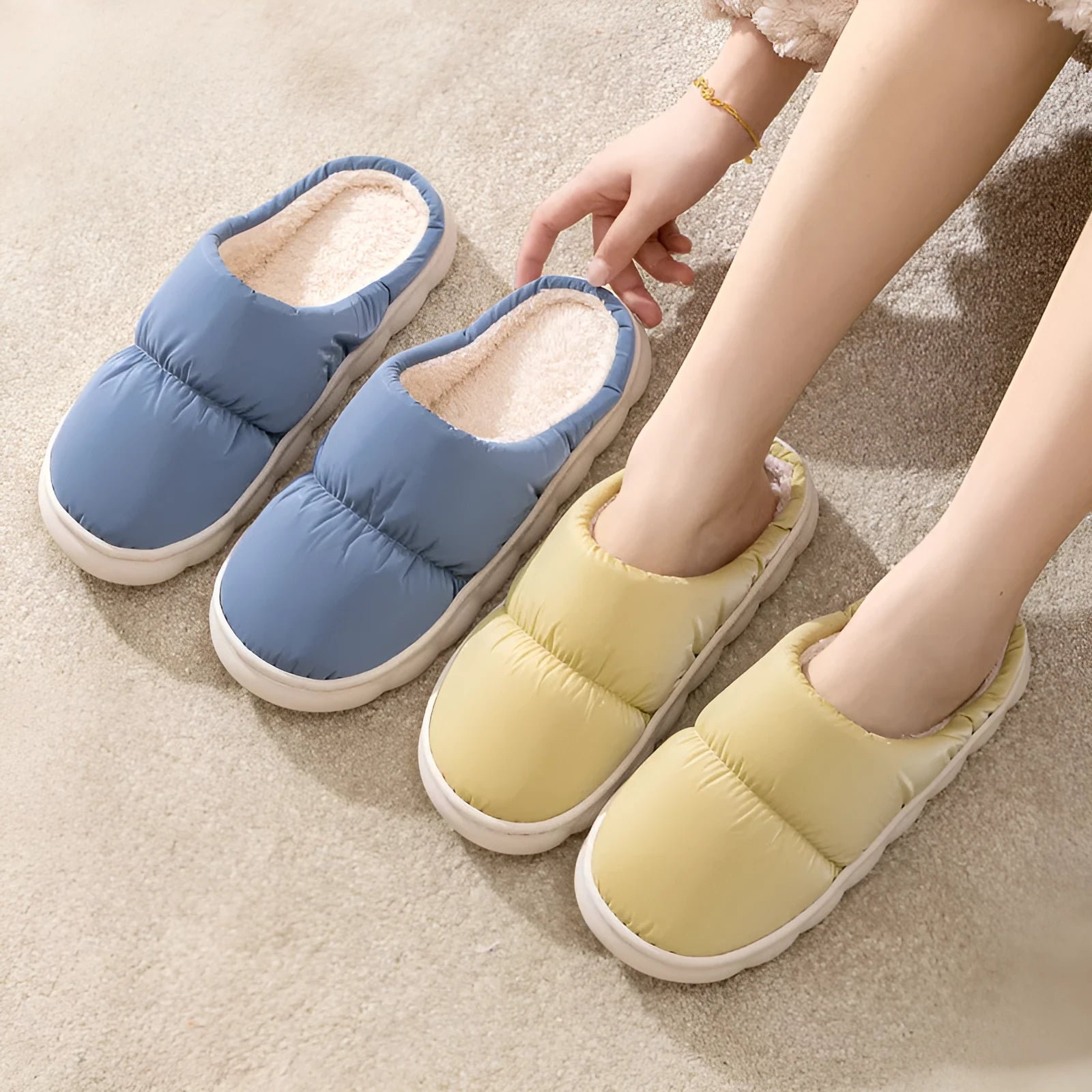 Blue winter slippers for indoor use with a thick rubber non-slip sole and artificial plush lining.