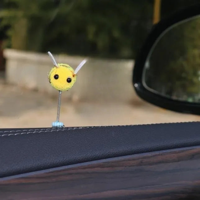 Square fur ball cartoon bee car decoration with black and yellow colours