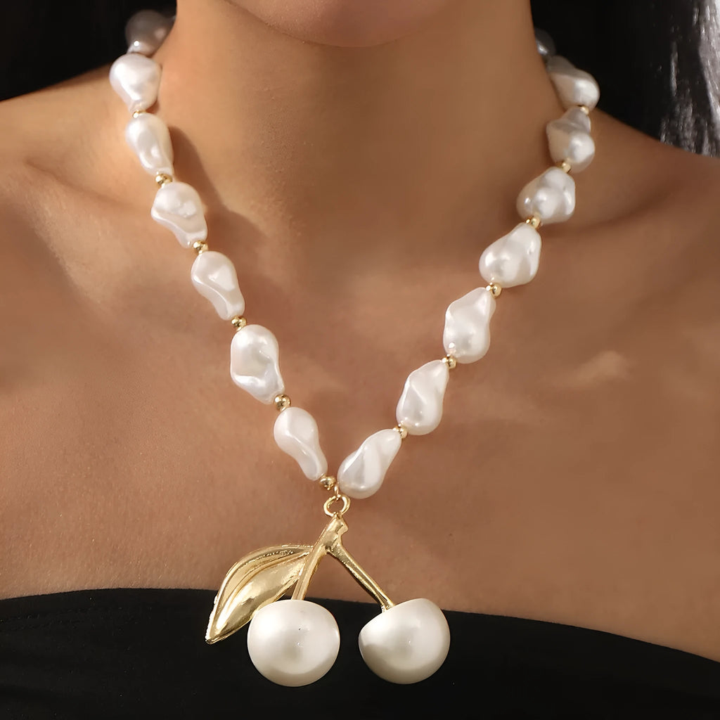 Women's adjustable cherry necklace with geometric fruit pendant on imitation pearl chain in gold or white K colour