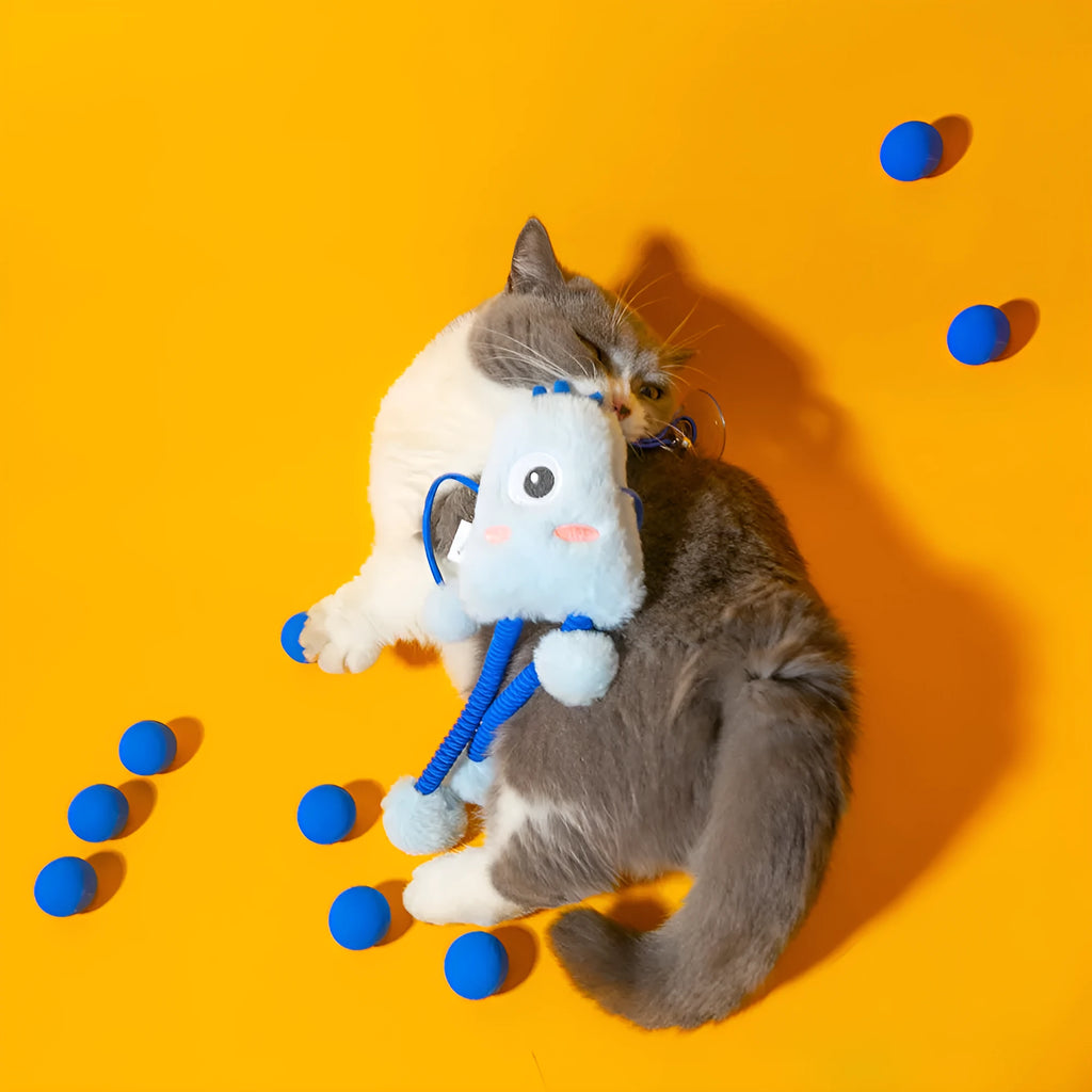 Blue telescopic elastic cat toy with plush mint-scented ring bell attachment extended during play