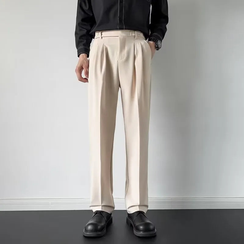 Men's straight fit suit trousers in apricot colour showing looser leg cut and polyester fabric texture