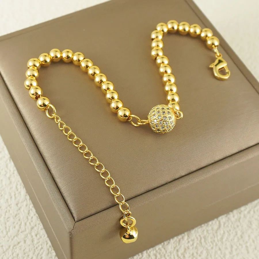 Women's heart-shaped copper bracelet with a single round zircon stone.