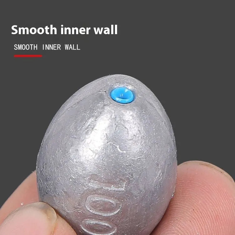 Olive-coloured rugby-shaped fishing sinker with a textured scale surface and plastic core, shown in various weights.