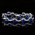 Geometric copper-plated gold colour bracelet with AAA+ zircon stones, total length 18.4 cm.