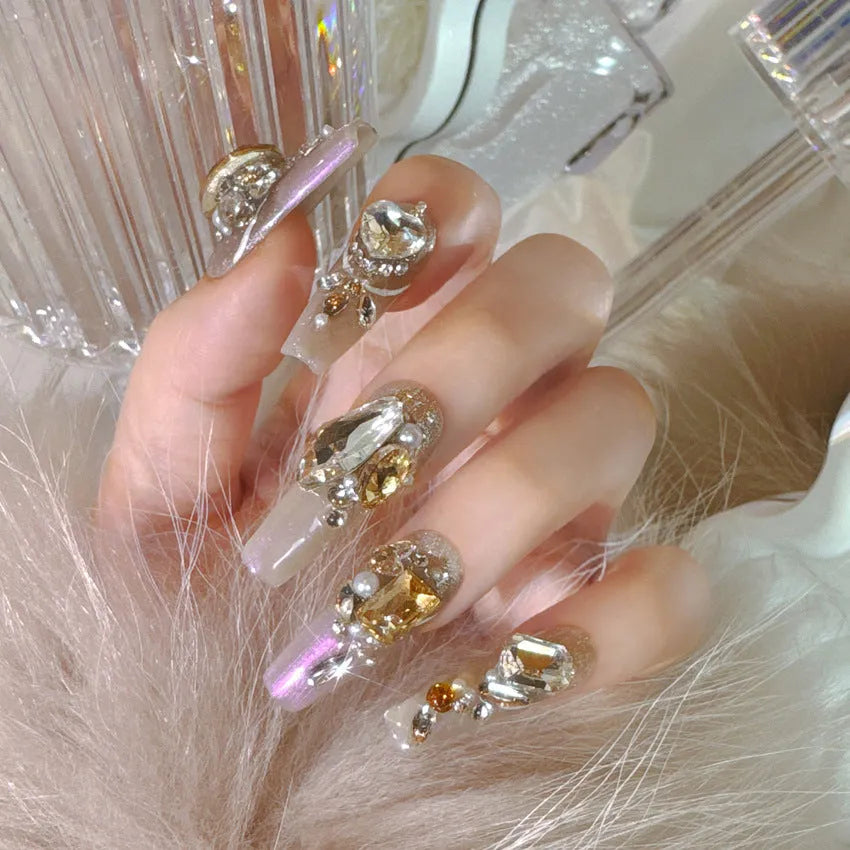Rhinestone decorated false nail patches on card, with choice of jelly adhesive or tool set.