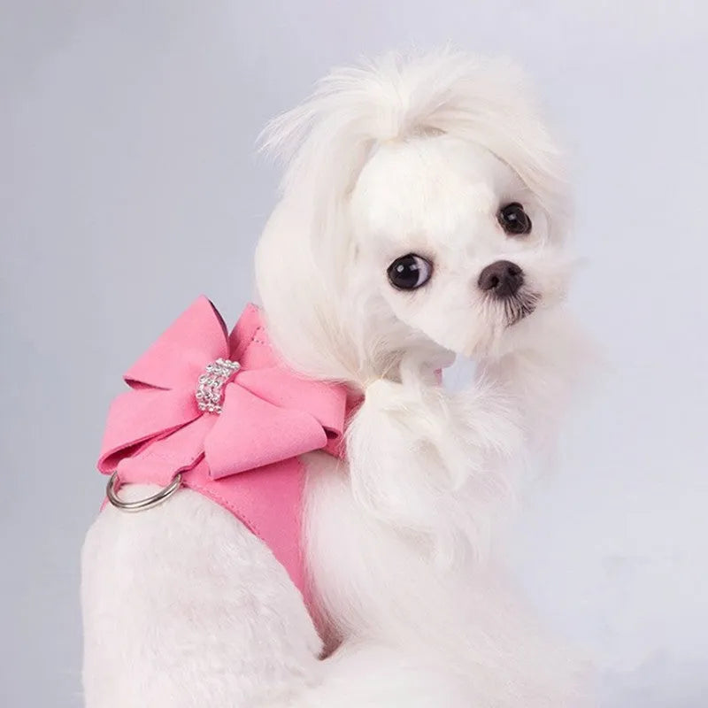 Cute pink microfiber dog chest strap harness with a large bowknot decoration and a metal D-ring.