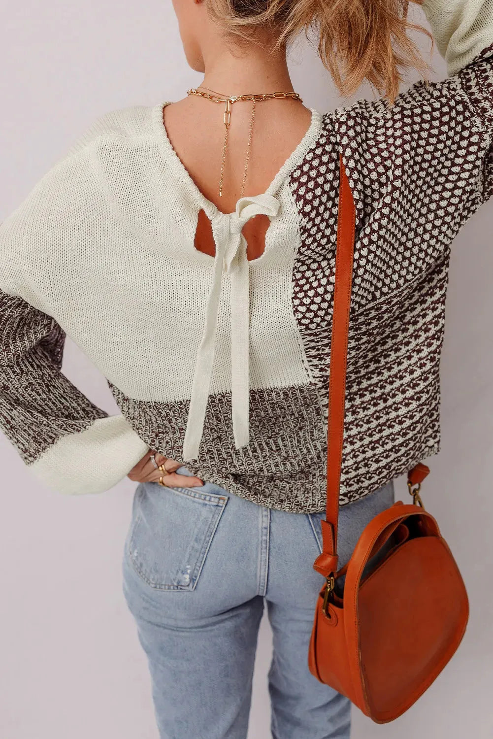 Dark khaki loose sweater with drop shoulders, colour block pattern, and a tie at the back.