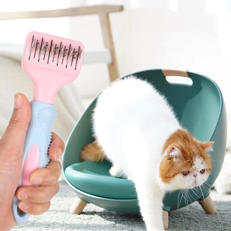Stainless steel dog comb and knot knife set with massage brush on a pink background
