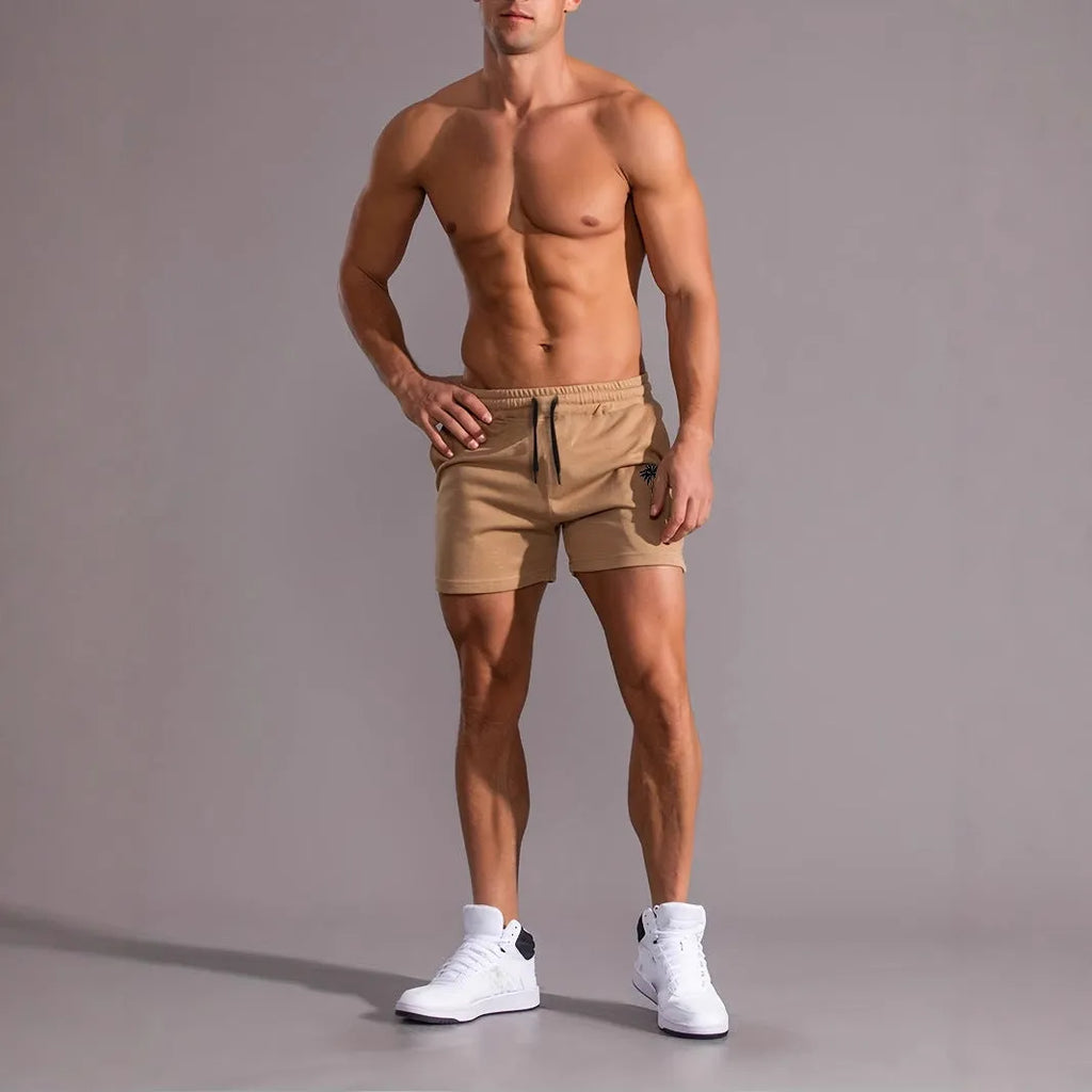 A pair of khaki men's casual shorts featuring a coconut print, shown in a straight-leg sports style.