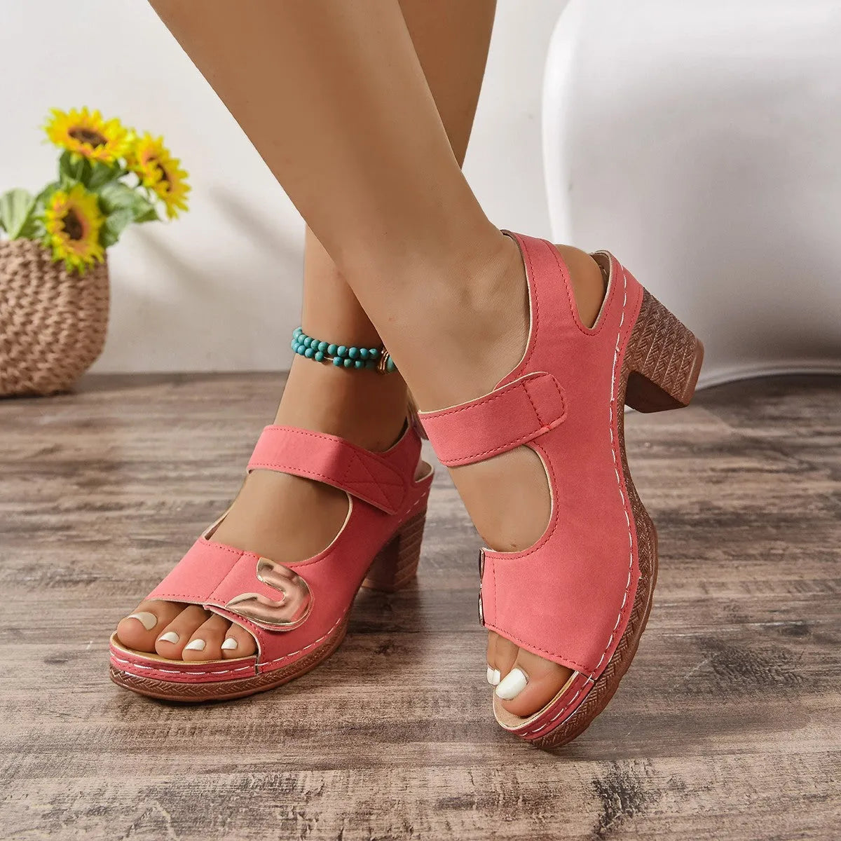 Light brown Velcro-strap Roman sandals with a round toe and rubber sole on a white background