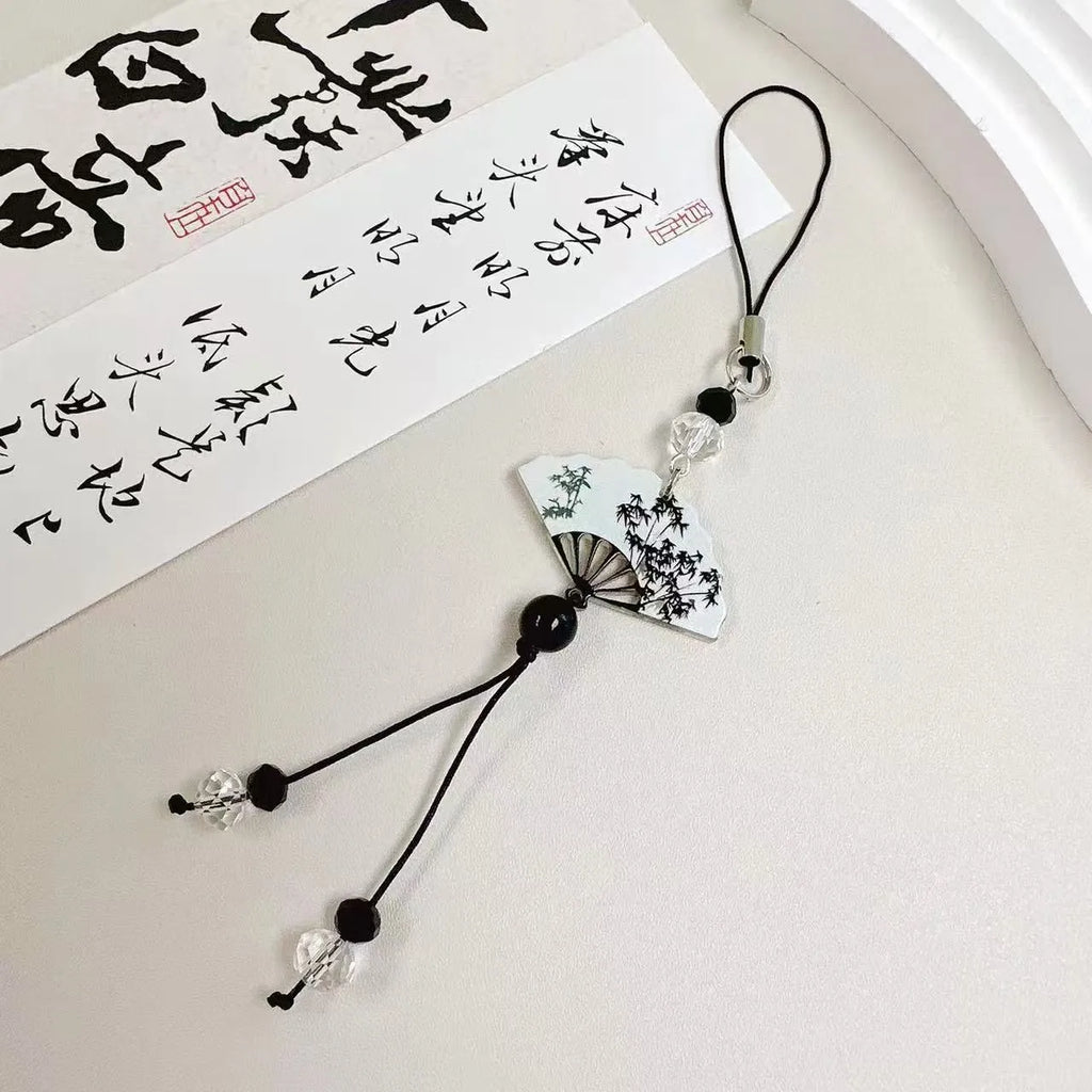 Guofeng Chinese style bead pendant keychain with detailed plant and flower pattern in a glossy finish.