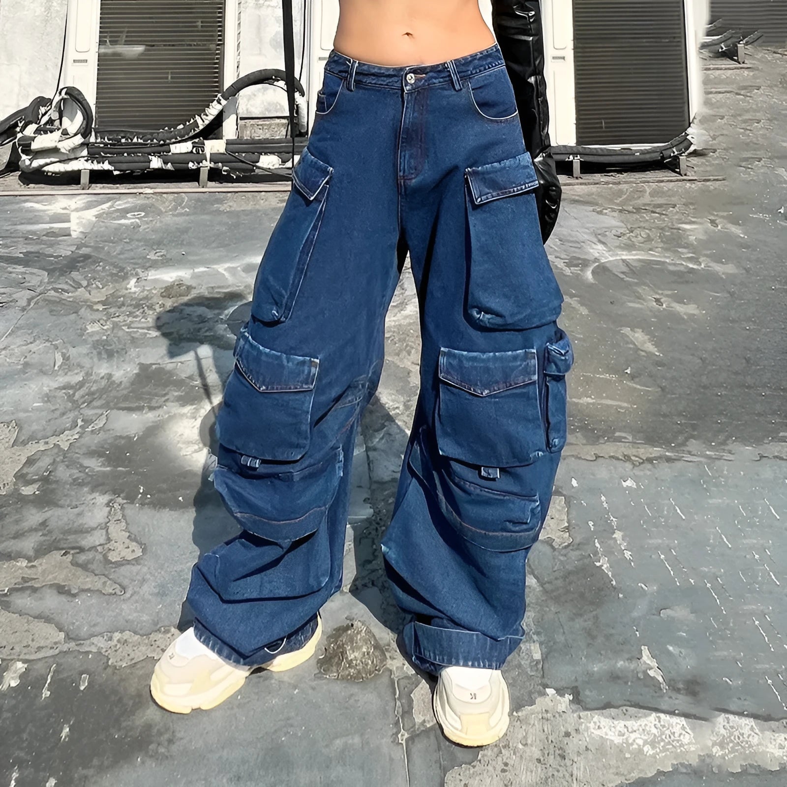 Dark blue distressed wide-leg denim jeans with high waist and multiple pockets laid flat.