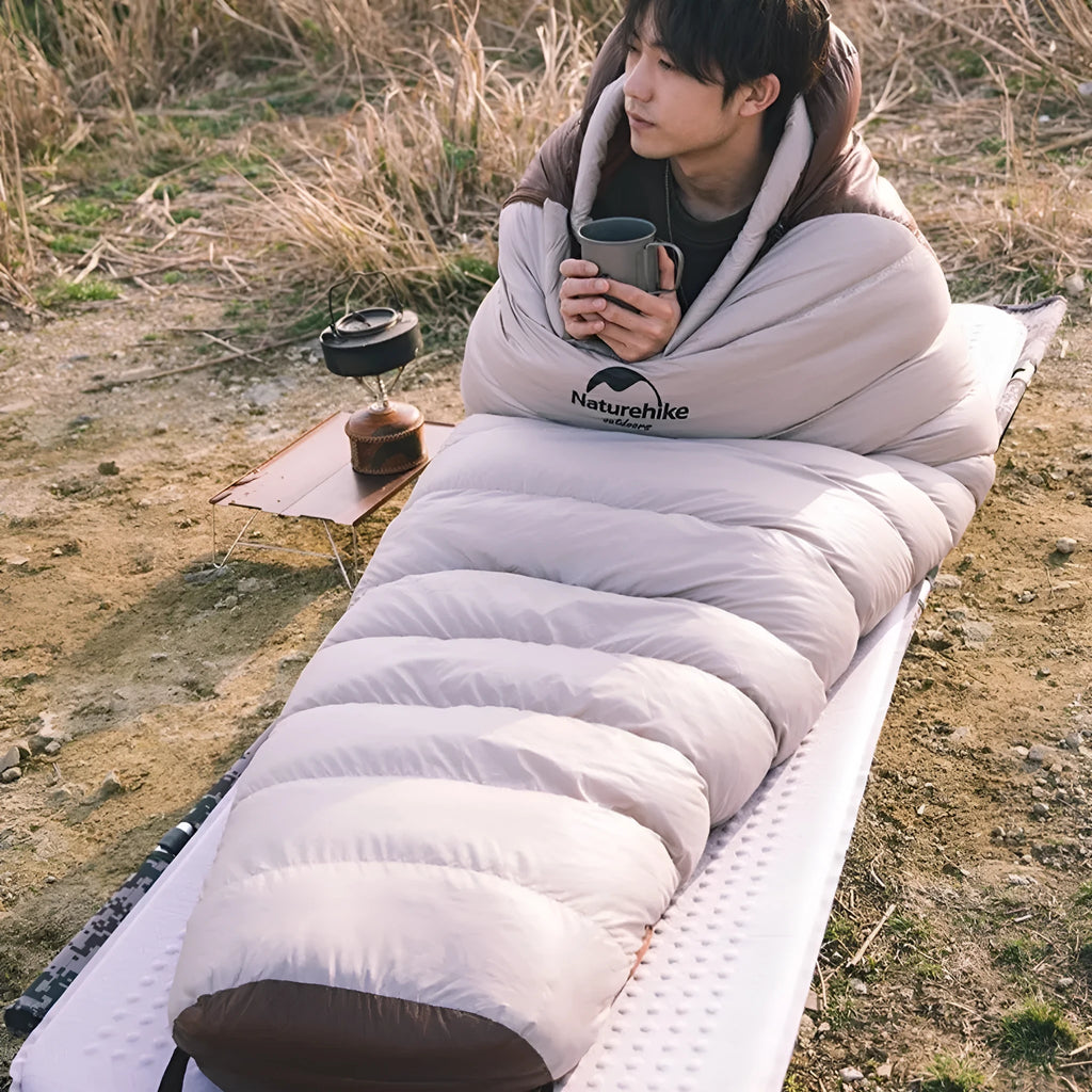 Mummy-style goose down sleeping bag with storage bag, shown in various size options