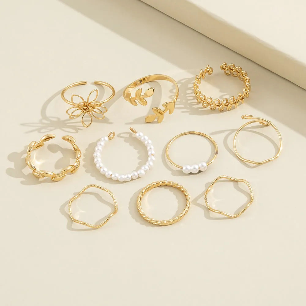 Women's gold openwork flower ring set with glossy electroplated finish