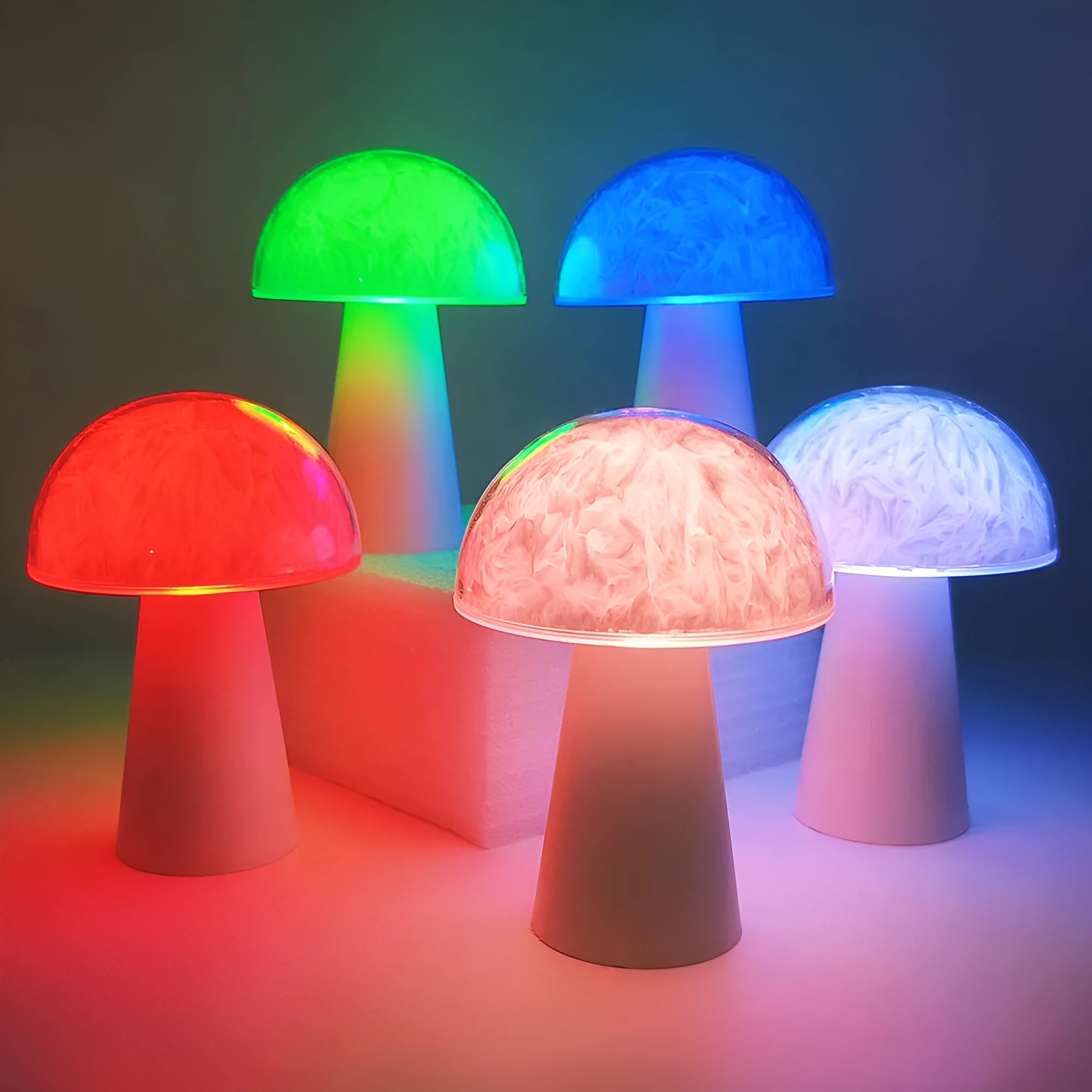 Mushroom-shaped RGB colour changing ambience lamp with remote control on wooden surface