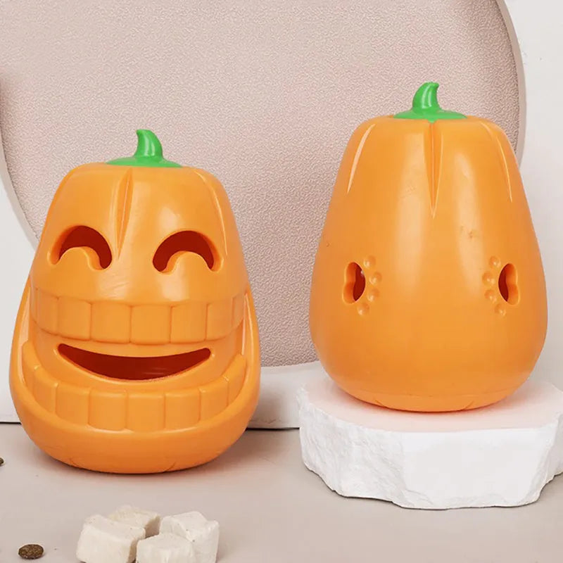 Halloween pumpkin shaped interactive dog chew toy with treat-dispensing funnel design