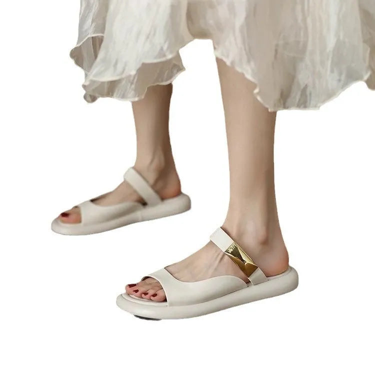 Women's apricot and white soft leather peep toe flat platform sandals with a rubber sole.