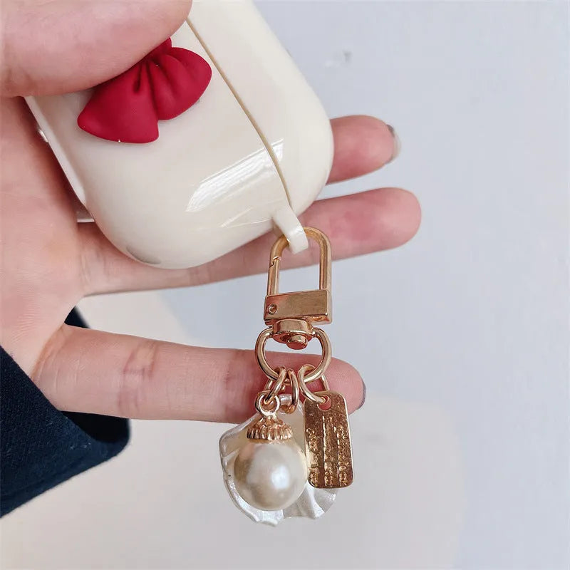 Beige red TPU clamshell earphone case with bow shell design for AirPods protection