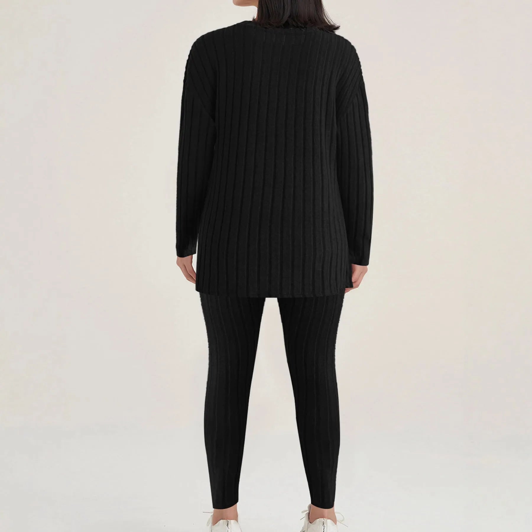 Black sunken stripe polyester two-piece loungewear set with top and pants.