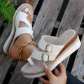 White women's wedge sandals with woven patent leather upper and peep toe.
