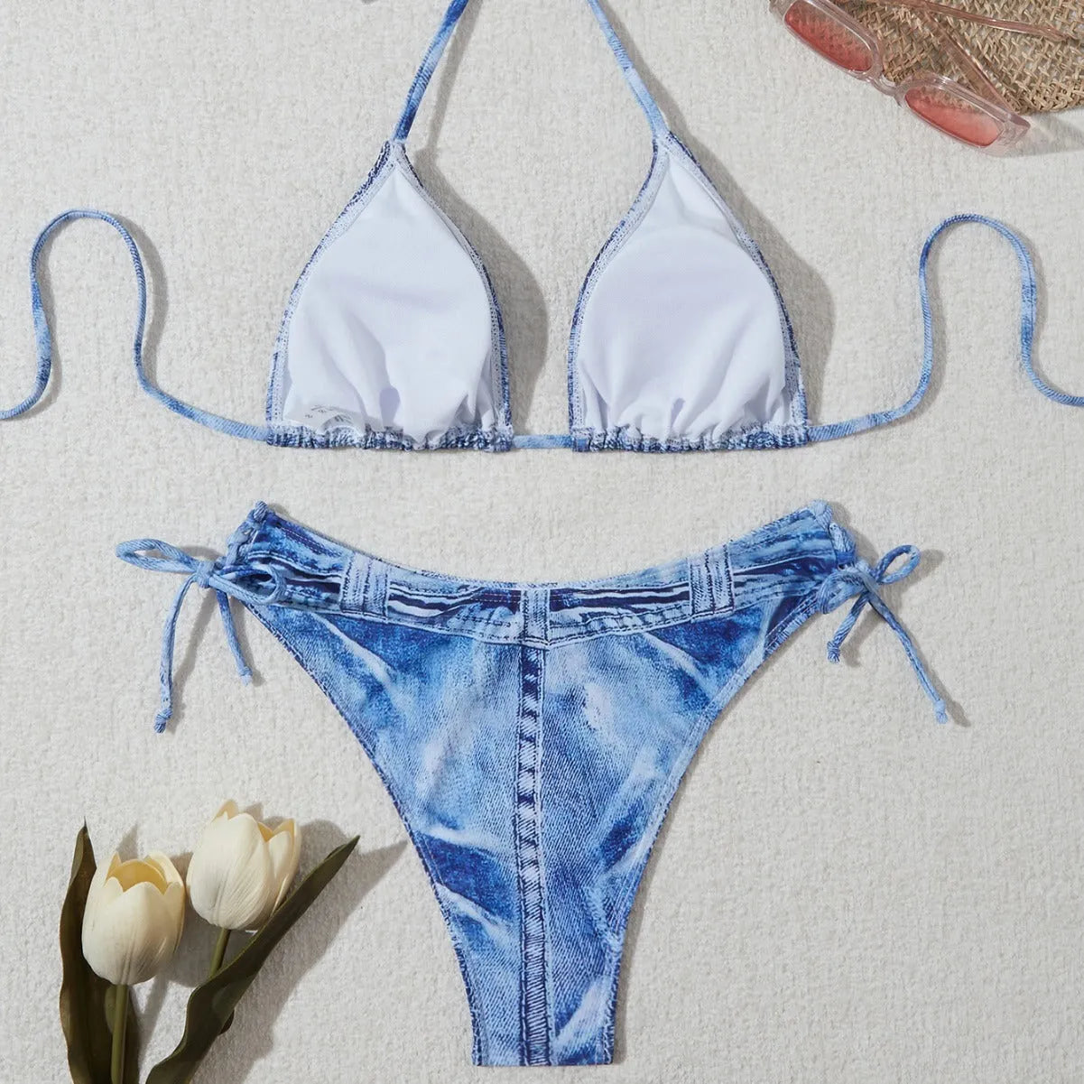 Women's denim blue strappy bikini set with printed design and two-piece swimwear construction