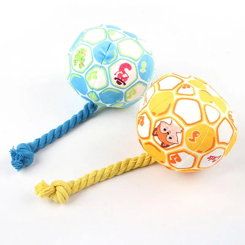Blue and yellow elastic football dog tug toy with cotton rope construction for chewing and interactive play