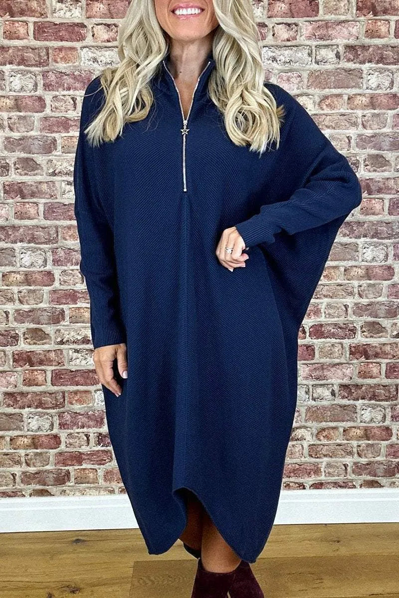 Women's solid colour knitted loose dress with zip and raglan sleeves, shown in dark green.