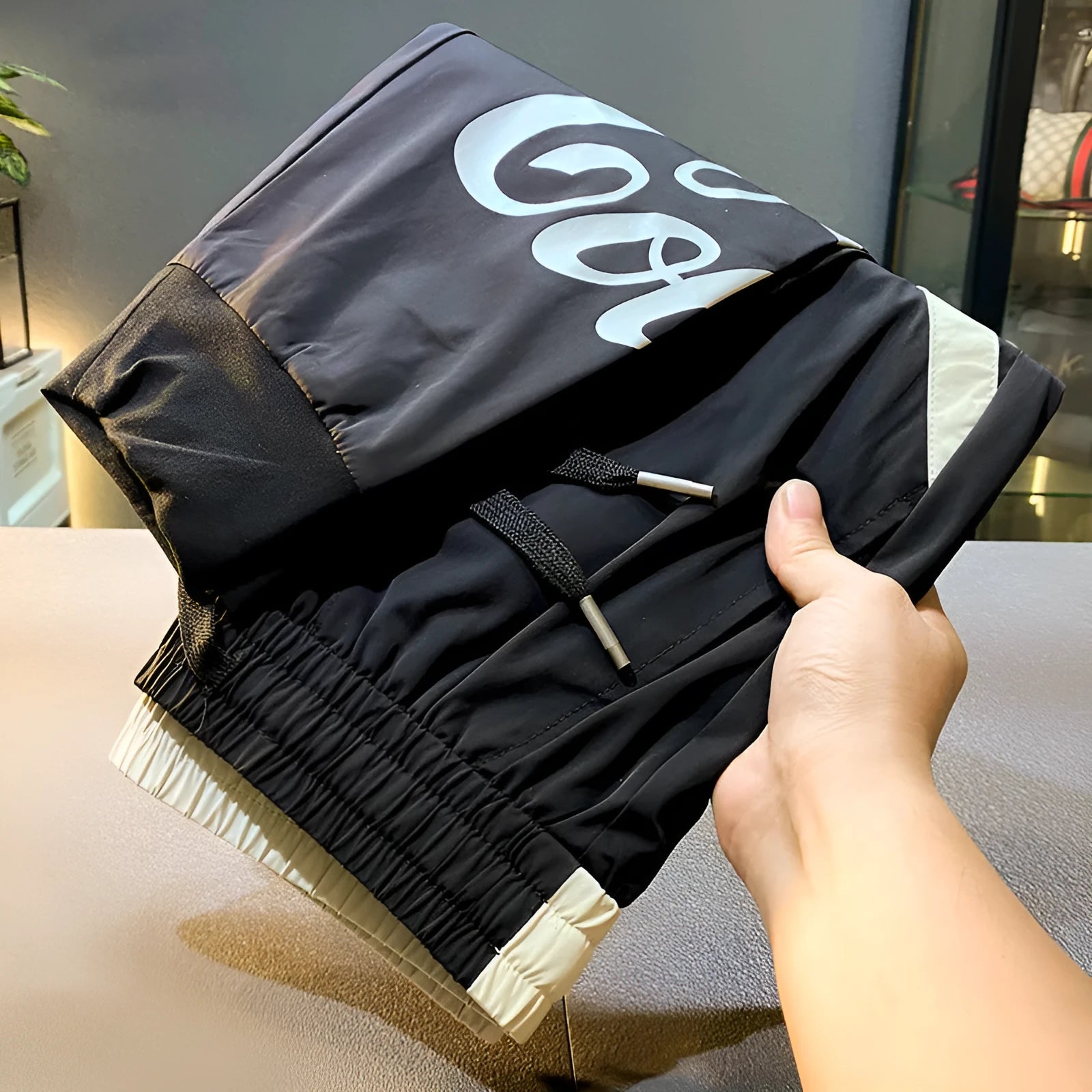 Black men's casual cropped trousers with an ankle band, made from ultra-thin ice silk cotton fabric.