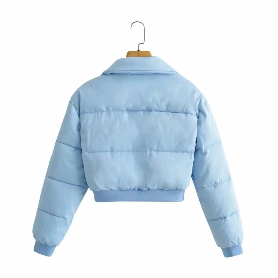 Women's loose fit long sleeve polyester jacket in blue colour on a hanger